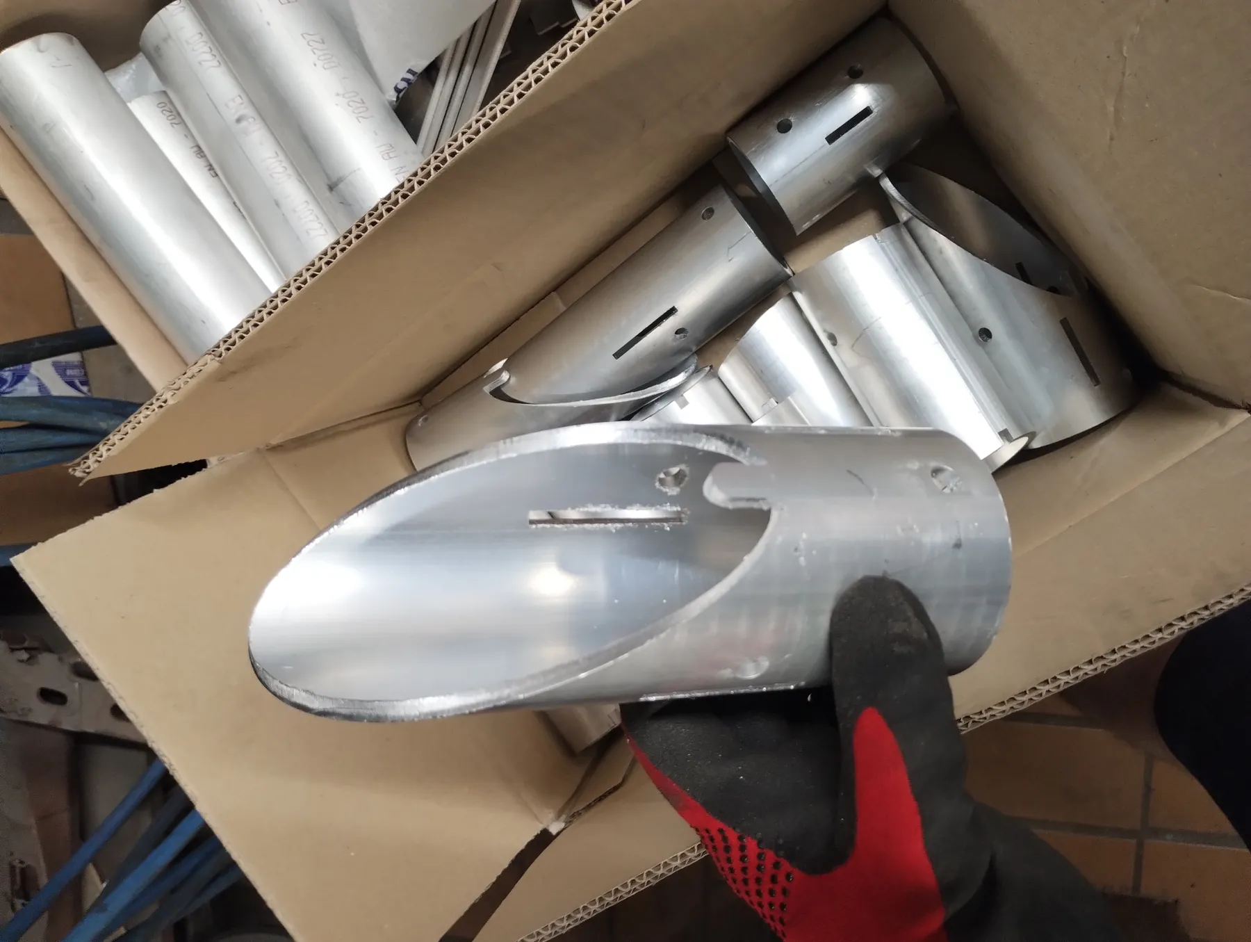 Laser-cut aluminium tubes in a box
